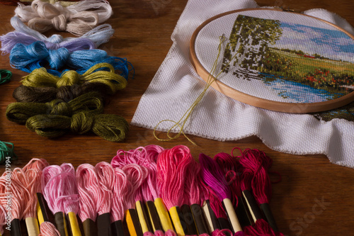 floss thread and embroidery hoop to lie on the table