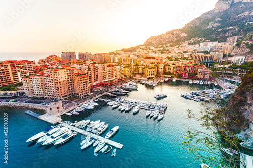 Panoramic view of Port de Fontvieille in Monaco. Azur coast. Colorful bay with a lot of luxury yachts in sunset. photo