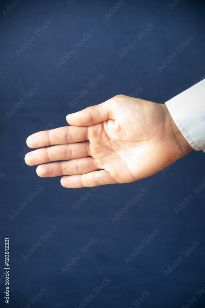 Businessman extending hand to shake blue backgorund Businessman extending hand to shake blue backgorund