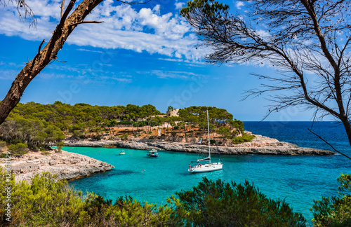 Beautiful bay with turquoise water and boats at anchor photo