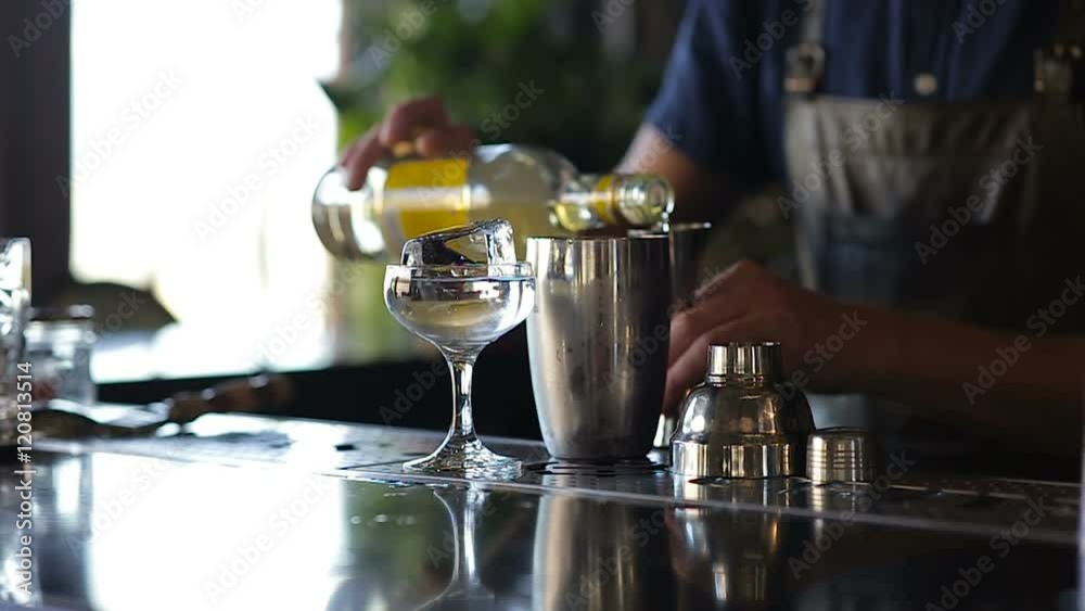 Hands of the barman add alcohol cocktail Hands of the barman add alcohol cocktail