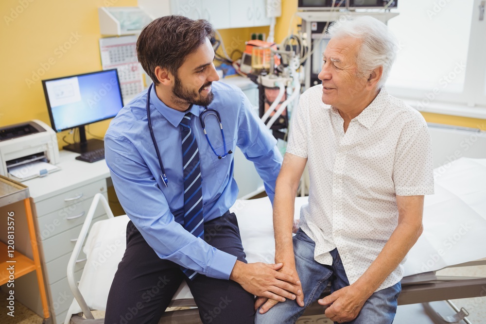 Fototapeta premium Male doctor examining a patient