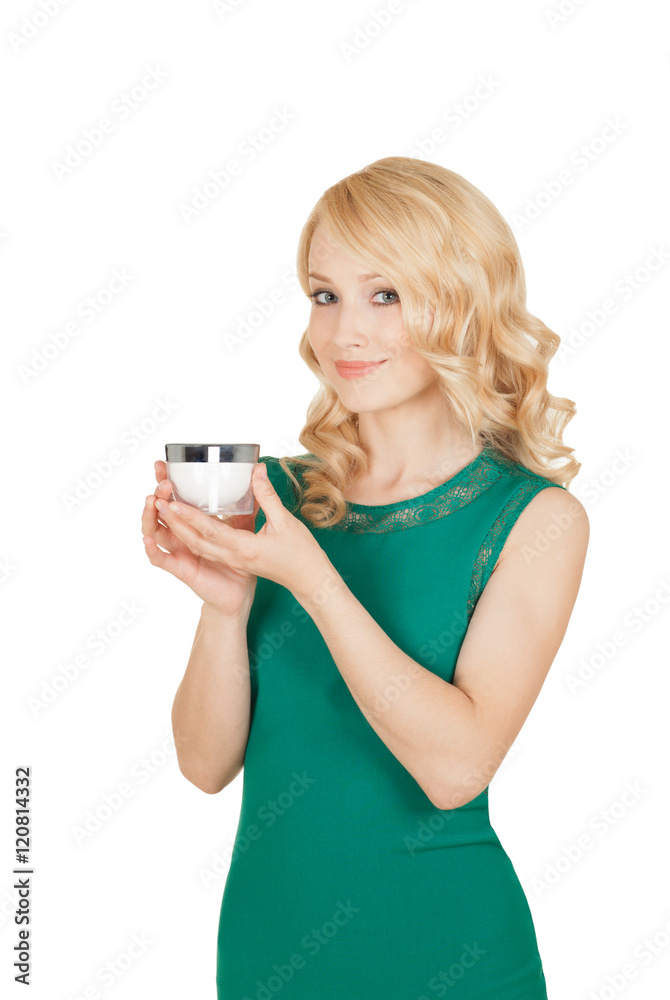 the beautiful blonde holds a cream jar in a hand the beautiful blonde holds a cream jar in a hand