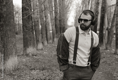 monochrome beard man listen music in park