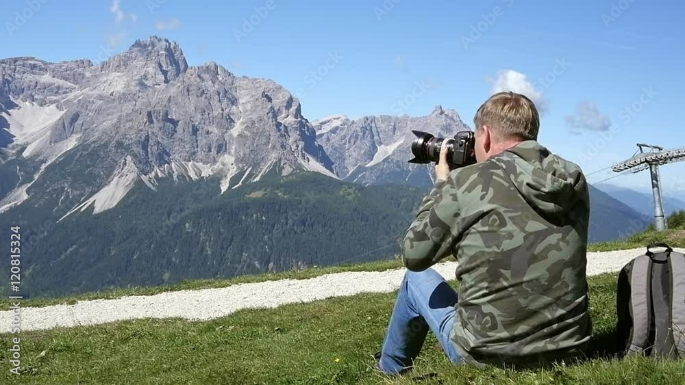 Photographer taking photos in the mountains Photographer taking photos in the mountains
