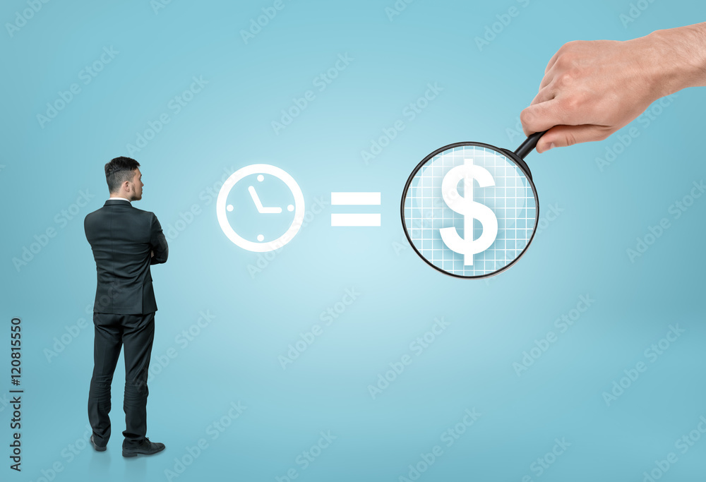 Businessman looking at sigh 'time is money' with big man's hand enlarging dollar sign by magnifier Businessman looking at sigh 'time is money' with big man's hand enlarging dollar sign by magnifier