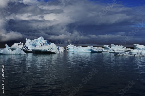 Ice lagoon under Vatnaj  kull glacier with stormy cloud on the sky