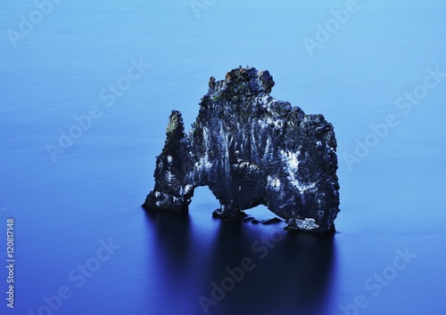 Lone rock in the sea, Vatnsnes, Iceland photo