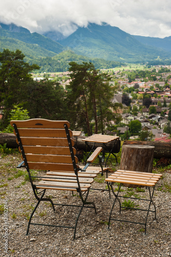 Rustic armchair and peaceful mountain view