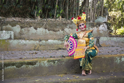 balinese dancer in old temple ruins in Bali