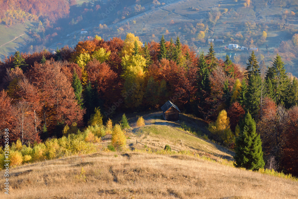 Autumn Landscape with a wooden house in the mountains Autumn Landscape with a wooden house in the mountains