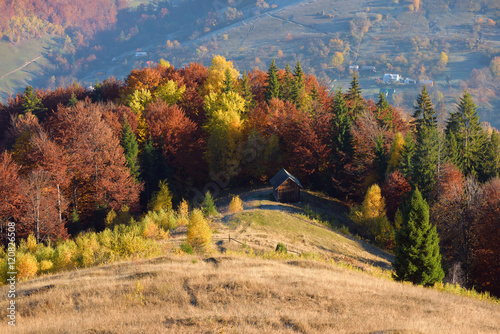 Autumn Landscape with a wooden house in the mountains