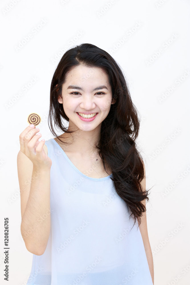 Young pretty lady with cookie isolated on white Young pretty lady with cookie isolated on white