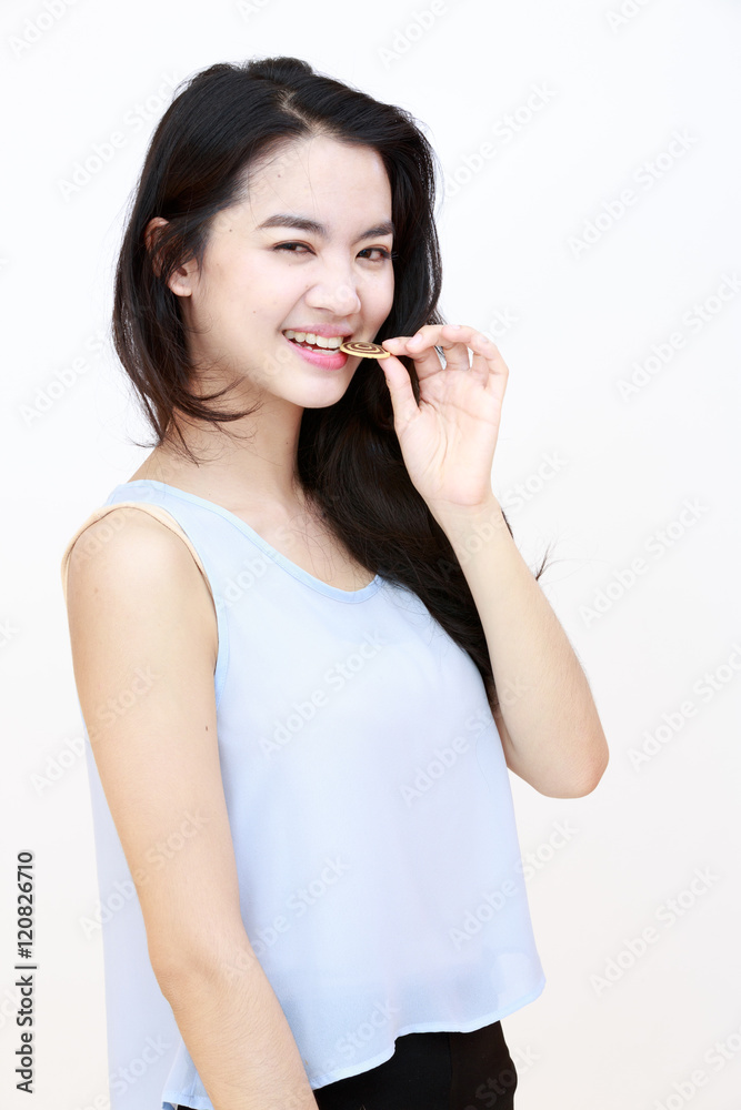 Young pretty lady with cookie isolated on white Young pretty lady with cookie isolated on white