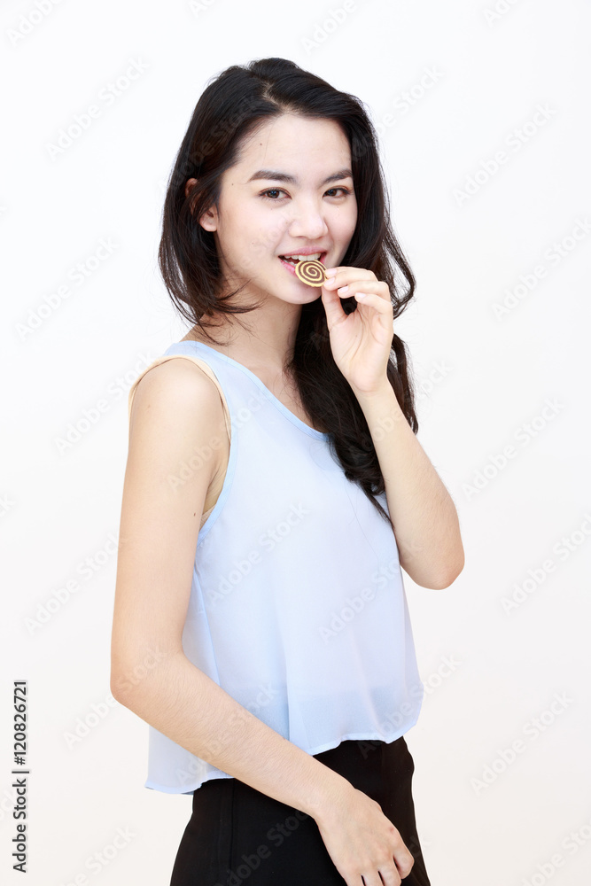 Young pretty lady with cookie isolated on white Young pretty lady with cookie isolated on white
