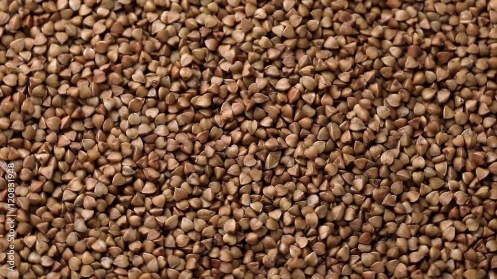Rotating raw buckwheat. Spinning closeup dry uncooked seeds. 1920x1080. Full HD
Rotating raw buckwheat. Spinning closeup dry uncooked seeds. 1920x1080. Full HD
