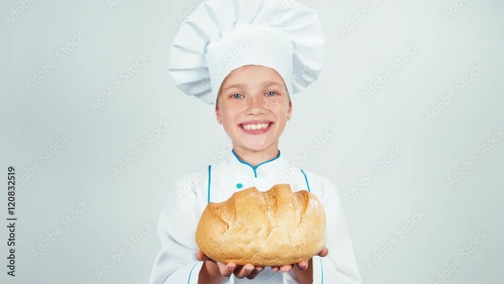 Close up portrait baker holds round bread in her hands and gives you and smiling at camera isolated on white Close up portrait baker holds round bread in her hands and gives you and smiling at camera isolated on white