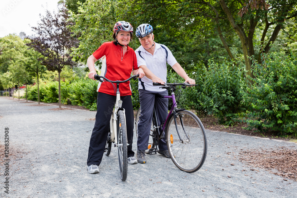Fototapeta premium Elderly Couple With Their Bicycles