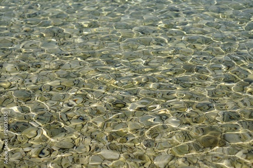  Sea bottom with pebbles underwater.
