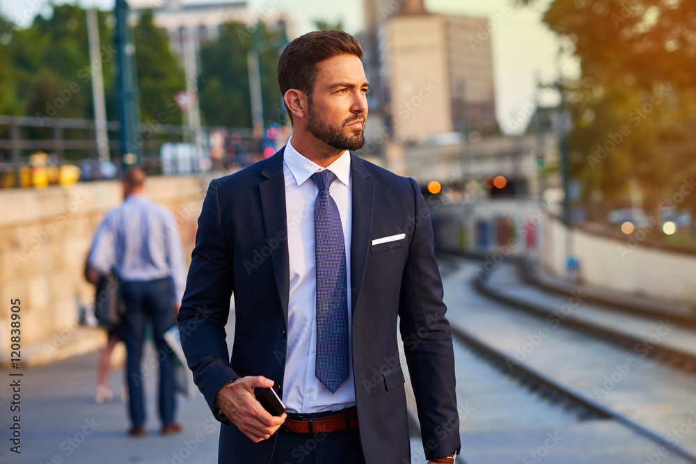 Young businessman in the tram stop Young businessman in the tram stop