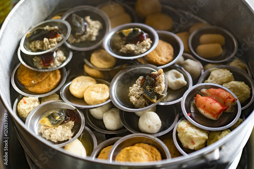 Variety of dim sum in small plate with smoke, Chinese cuisine, Selective focus