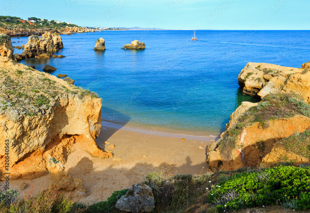 Yellow cliffs on beach (Algarve, Portugal).