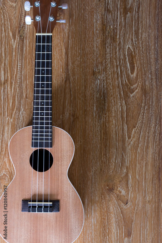 Fototapeta premium Ukulele on wood table