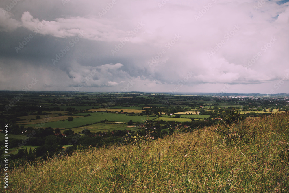 Fototapeta premium Cloudy view over the Chilterns in Buckinghamshire Vintage Retro