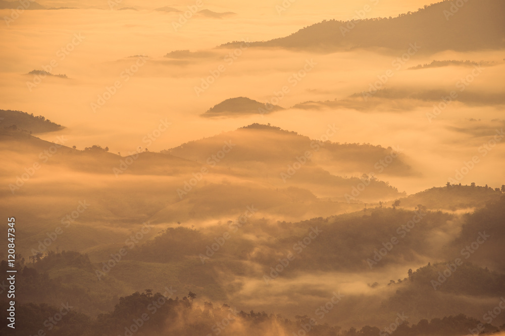 The fog cover the high mountains in northern Thailand when the sunrise.