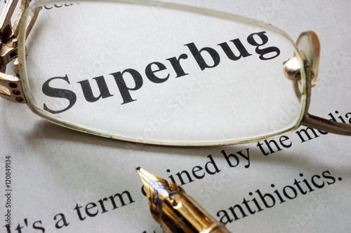 Paper with word superbug and glasses. Medical concept. photo