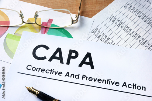 Paper with words CAPA Corrective and Preventive action plans photo