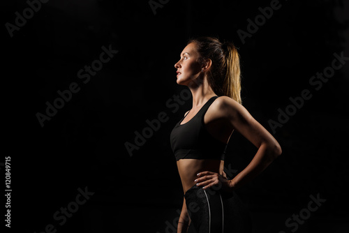 Studio shot of a beautiful young woman posing against a black background. This is what hard work and dedication looks like