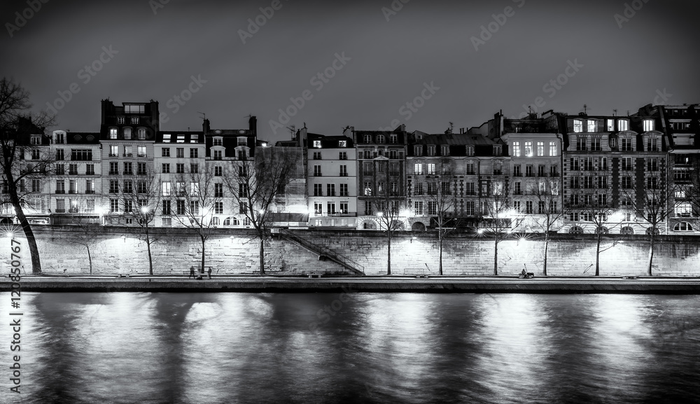 Paris night skyline panorama of old houses along the Seine River