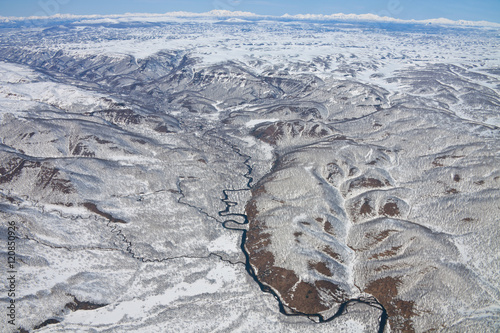 Views of the foothills of the Karymsky volcano from a helicopter photo