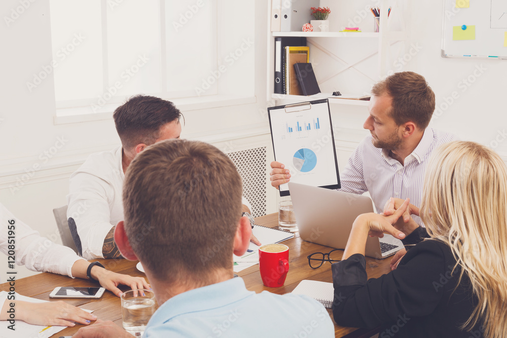 Business meeting. Young hipster businessman in modern office Business meeting. Young hipster businessman in modern office