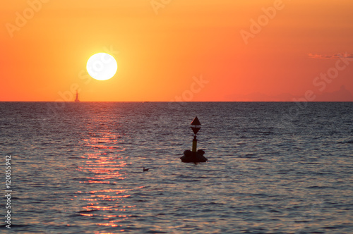 buoy floating in the sunset 