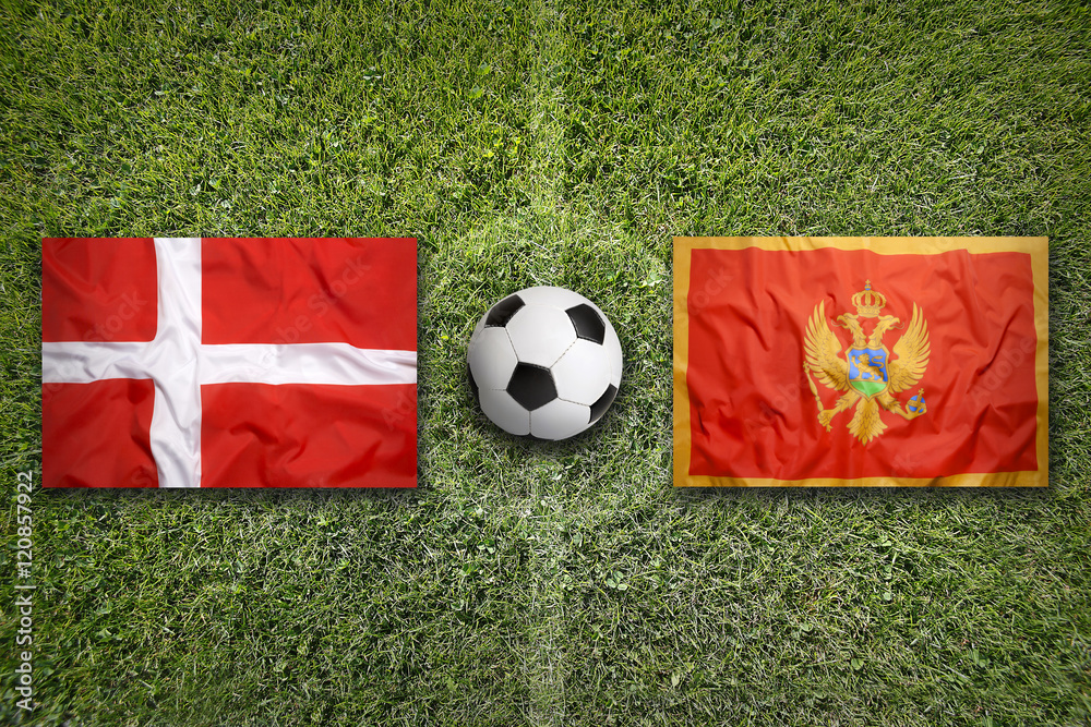Denmark vs. Montenegro flags on soccer field Stock Photo | Adobe Stock