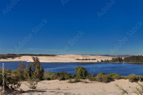 White sand dunes with lake at Mui Ne village Vietnam © AnnaMoskvina