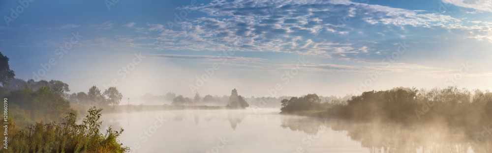 Foggy river in the autumn morning