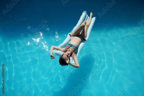 Young woman relaxing in pool