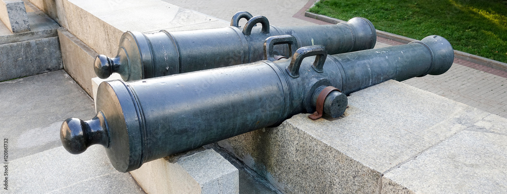 Cannon of the nineteenth century on the wall Cannon of the nineteenth century on the wall
