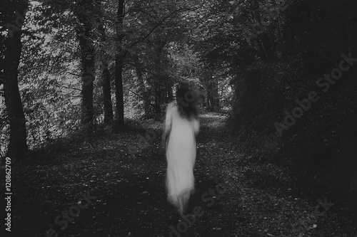 Running woman in the forest photo