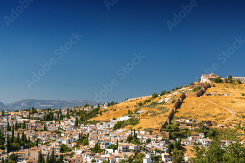 Sunny view of Granada from viewpoint of garden of Generalife, Andalusia province, Spain.