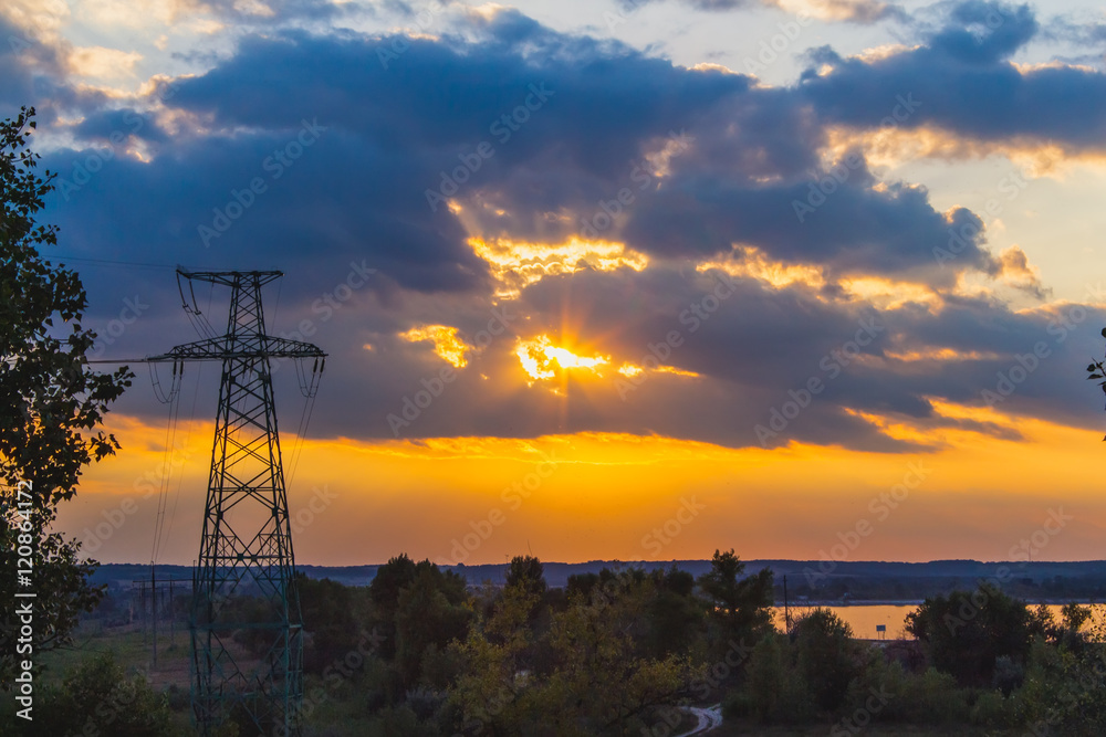 High voltage electric pylon in sunset background. Ukraine.