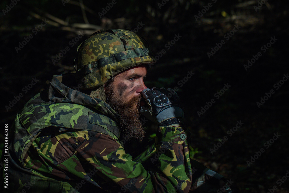 Young soldier with gun