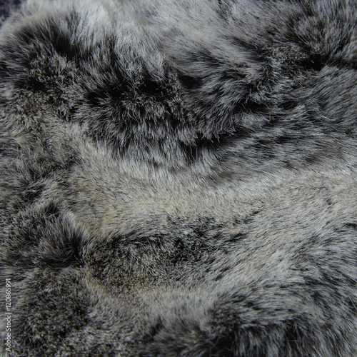 A full page of fluffy grey fake fur fabric background texture