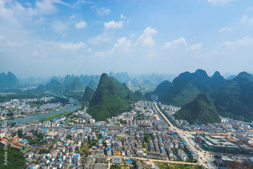 Air view on Yangshuo city with karst mountains around.  Yangshuo, China