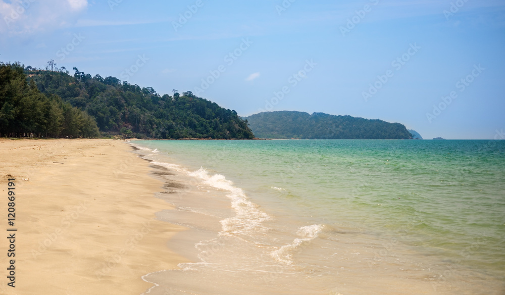 Lonely sandy beach. Green hills, blue sea, white sand Lonely sandy beach. Green hills, blue sea, white sand