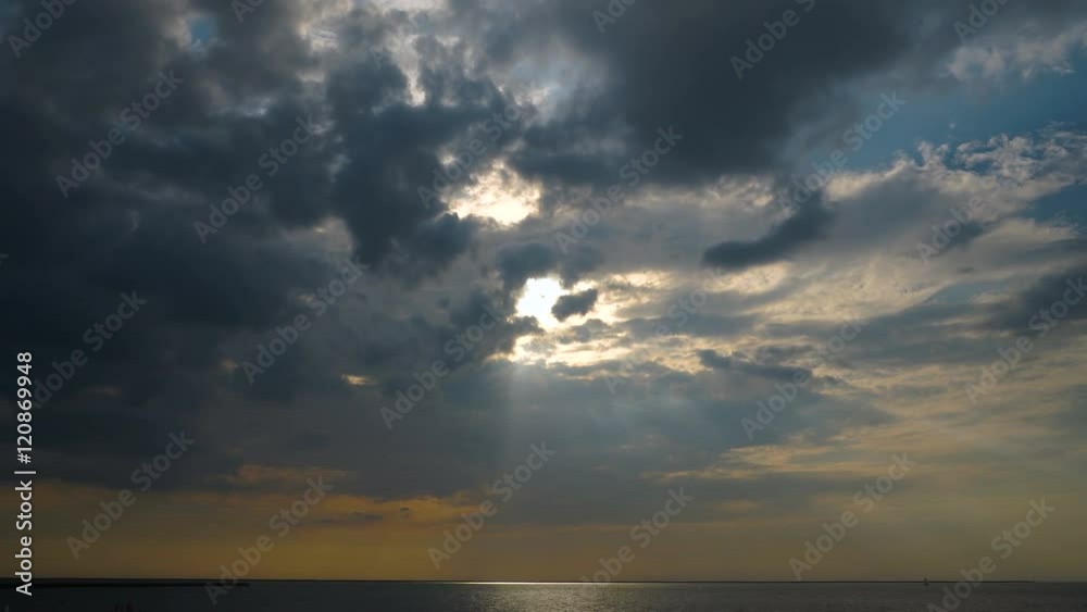 Sun rays through the clouds over the sea time lapse Sun rays through the clouds over the sea time lapse