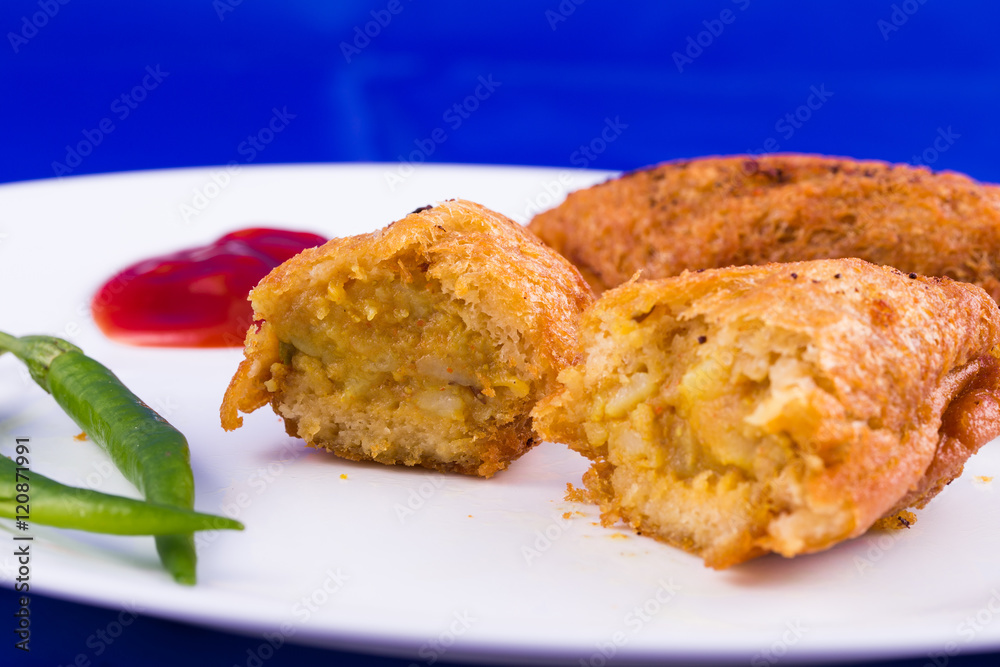 Indian food - vegetarian bread roll with stuffed potatoes Indian food - vegetarian bread roll with stuffed potatoes